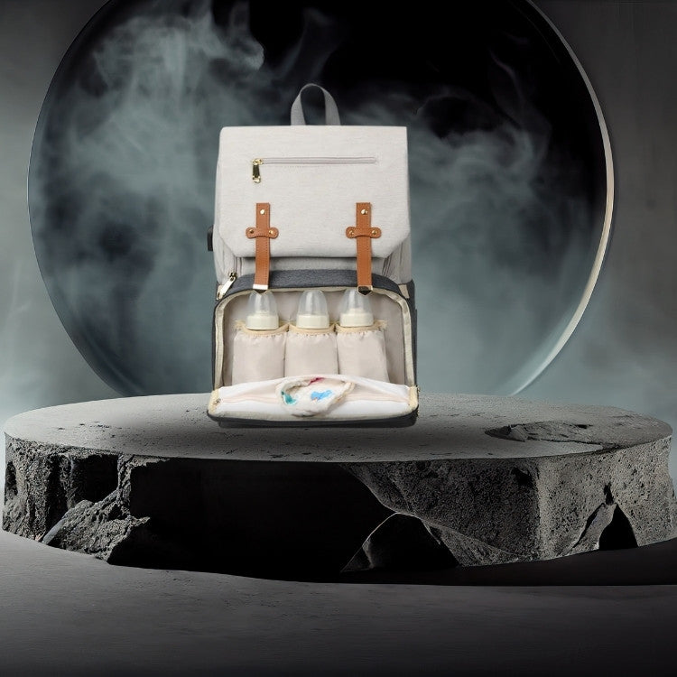 sac a langer dos gris et blanc avec biberon